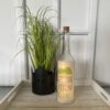 Glasflasche mit Spruch: "LET THE EVENING BEGIN" mit 5er LED-Beleuchtung (Batteriefach)